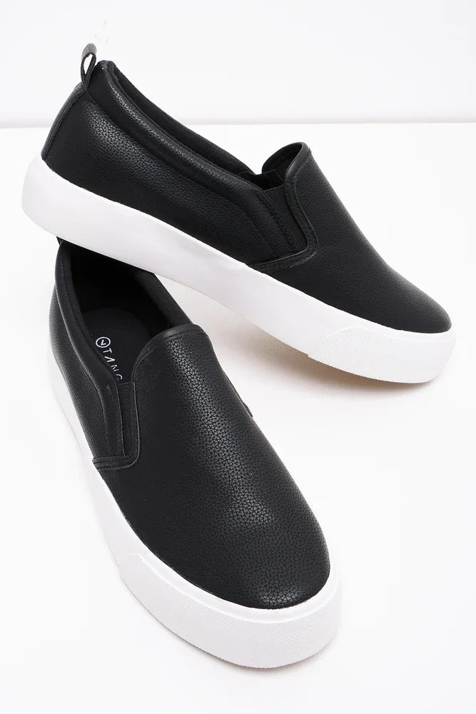 Black and white slip on trainers hotsell